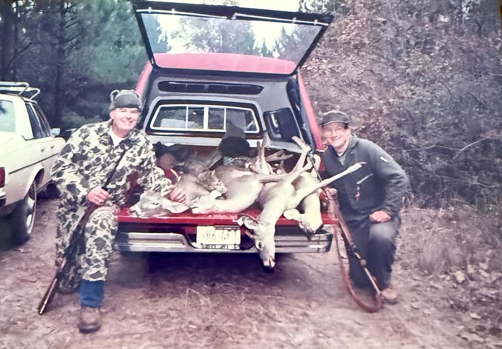 Dad and Gilbert at deer lease, killed deer