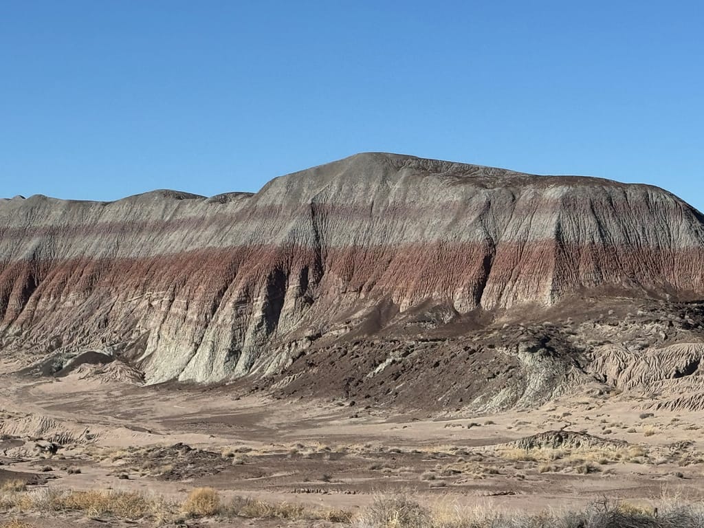 Mountain of red, grey, and purple