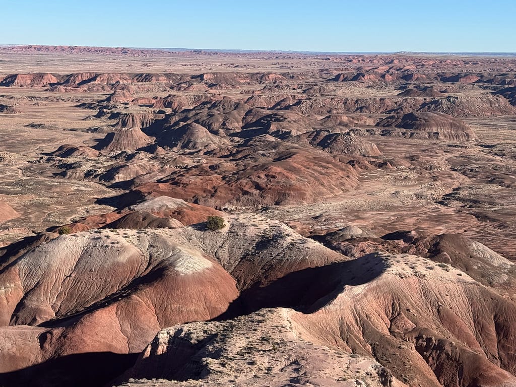 Red and white scene of hills