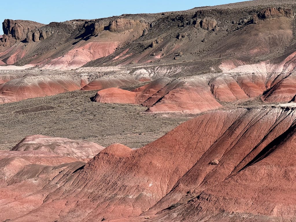 Hills with brown, white, red, and black