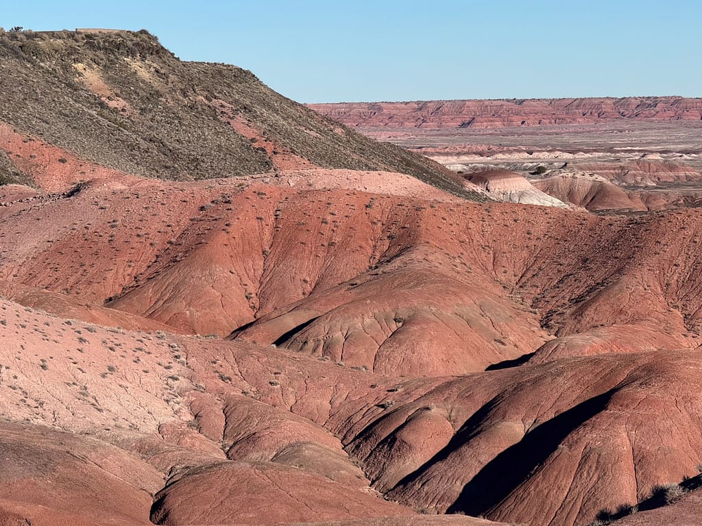Plateau with green, rolling red hills