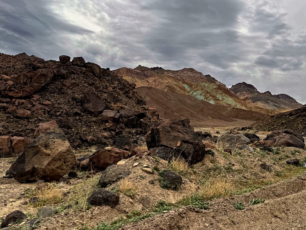 black, tan green rocks