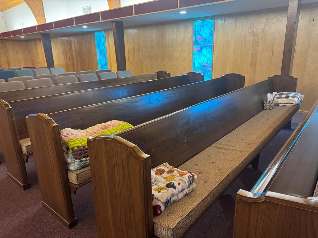 The blankets and pillows on the pews of FBC Gordonville, TX